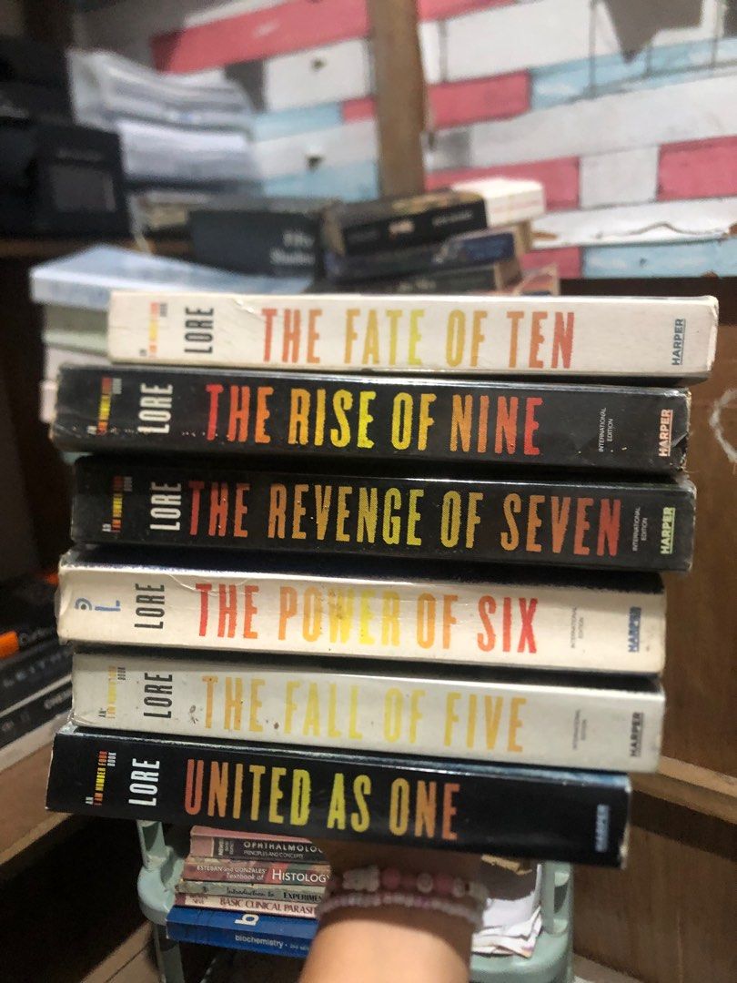 I Am Number Four Series by Pittacus Lore (Category: Storybooks) located in Baroy. Submitted by suzannejean (Listing ID 1412688820, Image 1). Description: Set of six books from the I Am Number Four series by Pittacus Lore. Titles include "The Fate of Ten", "The Rise of Nine", "The Revenge of Seven", "The Power of Six", "The Fall of Five", and "United as One". As you can see in the pictures, there’s visible foxing and tan edges. Buy at your own ris
