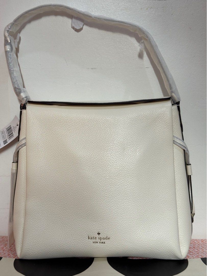 Kate Spade Dumpling Shoulder Bag (Category: Luxury Bags & Wallets) located in Quezon City. Submitted by branded_jo (Listing ID 1412670297, Image 1). Description: Original Kate Spade Dumpling Shoulder Bag Color White/Meringue Size Large Pebbled Leather Brand new with tag Bought in US Lalamove Ready Paper bag (till supplies last).