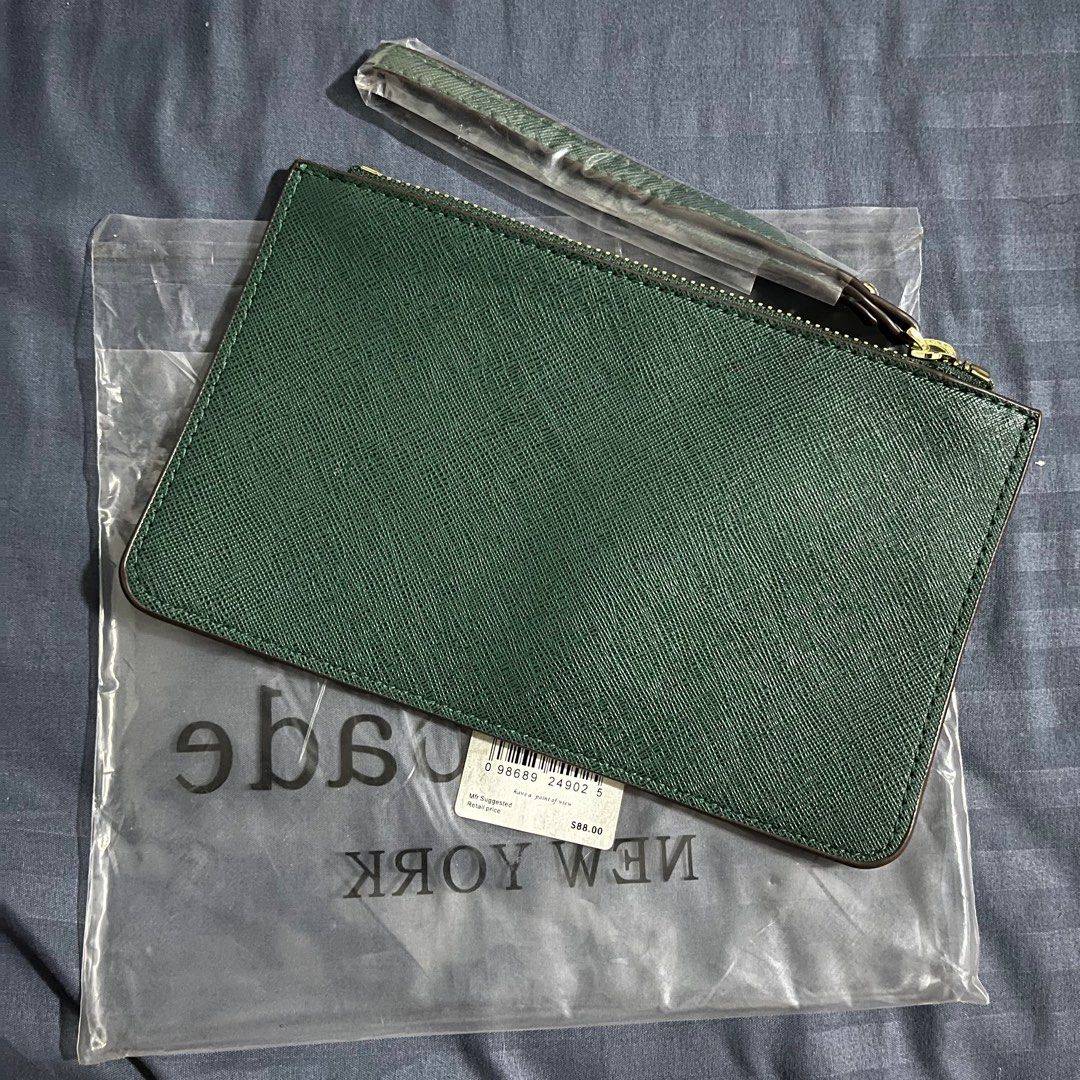 Kate Spade Green Wristlet (Category: Luxury Bags & Wallets) located in Quezon City. Submitted by miles.viii (Listing ID 1412702136, Image 2). Description: - Kate Spade wristlet - Stunning green color - Gold-toned zipper - Includes wrist strap - Brand new, in original packaging - Original price tag: $88.00 - Features the Kate Spade New York logo.