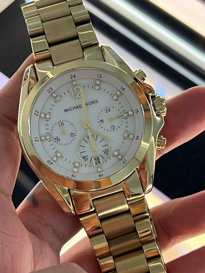 Michael Kors MK Gold Watch with Diamonds (Category: Women's Watches) located in Quezon City. Submitted by kenjixx (Listing ID 1412706663, Image 2). Description: My cousin gave it to me Only minimal scratches at the back because the plastic has been removed Kept in the box With box No scratches on the face and body .