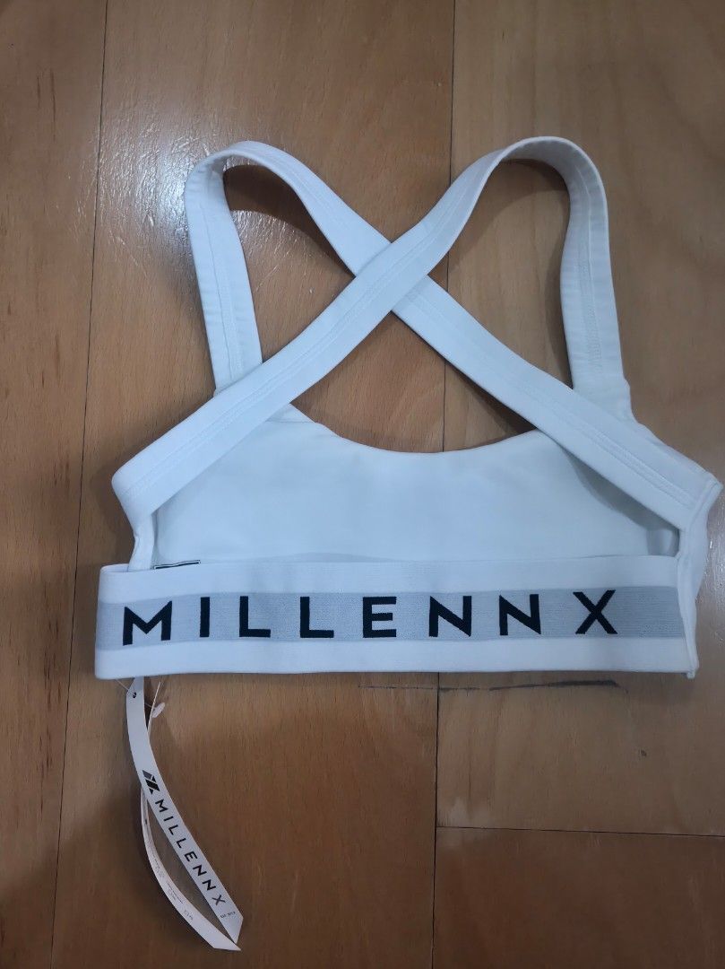 Millennx Extra Small Sports Bra white (Category: Activewear) located in Quezon City. Submitted by mooneon (Listing ID 1412606838, Image 2). Description: - Millennx white sports bra - Size: Extra Small (XS) - Features a stylish cross-back design - Brand name printed on the side - Made in the Philippines - Perfect for workouts or everyday wear - Condition: Unworn.