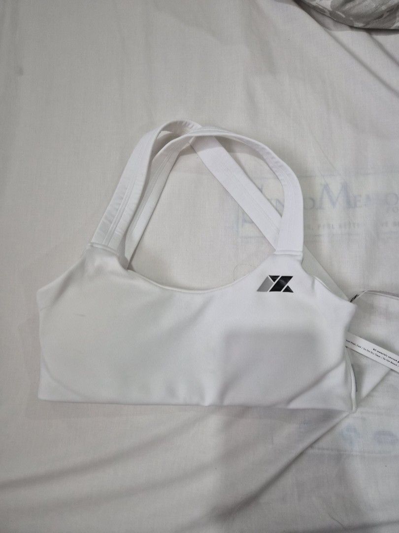 Millennx Extra Small Sports Bra white (Category: Activewear) located in Quezon City. Submitted by mooneon (Listing ID 1412606838, Image 1). Description: - Millennx white sports bra - Size: Extra Small (XS) - Features a stylish cross-back design - Brand name printed on the side - Made in the Philippines - Perfect for workouts or everyday wear - Condition: Unworn.