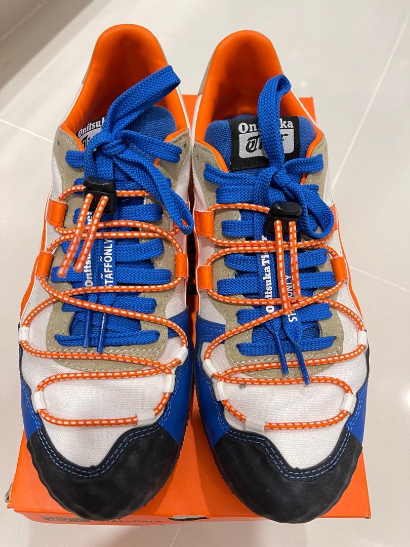 Onitsuka Tiger Serrano White/Habanero Sneakers - US 8 (Category: Sneakers) located in Singapore. Submitted by waysg (Listing ID 1412677304, Image 2). Description: - Onitsuka Tiger Serrano sneakers - Eye-catching white, orange, and blue color scheme - US size 8, Euro 41.5, UK 7 - Includes original box and tags - Adds a vibrant pop of color to any outfit.