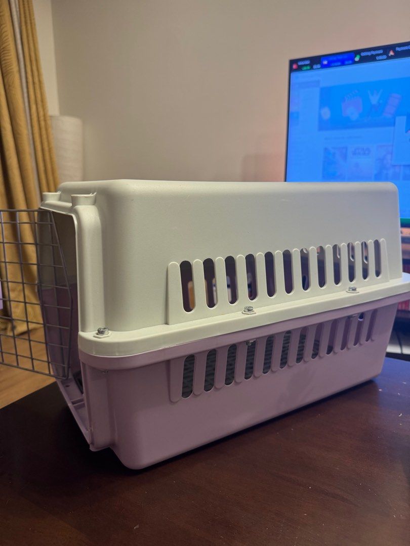 Pet Carrier - Small Size (Category: Homes & Other Pet Accessories) located in Makati City. Submitted by danandy12 (Listing ID 1412641664, Image 3). Description: - Small pet carrier - White and purple color combination - Secure metal door - Ventilation slots for airflow - Removable floor for easy cleaning - Designed for safe and comfortable pet travel Perfect condition 🫶🏻 RFS: Decluttering.