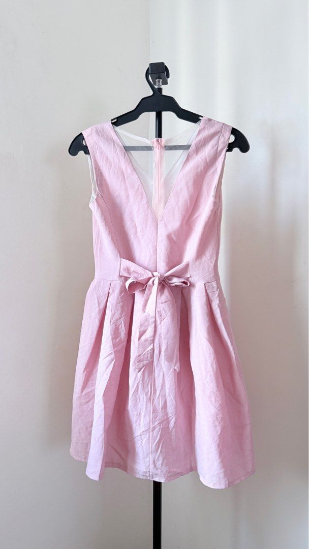 Pink Sleeveless Dress (Category: Dresses) located in Tanauan. Submitted by orioo_08 (Listing ID 1412596934, Image 3). Description: - Sleeveless light pink dress - Features a flattering V-neck - Fitted waist with a cute bow detail at the back - Stylish pleated skirt - Size: W-13.5" , L-30" RFS: Decluttering Location: Tanauan Batangas Courier: J&T Express.