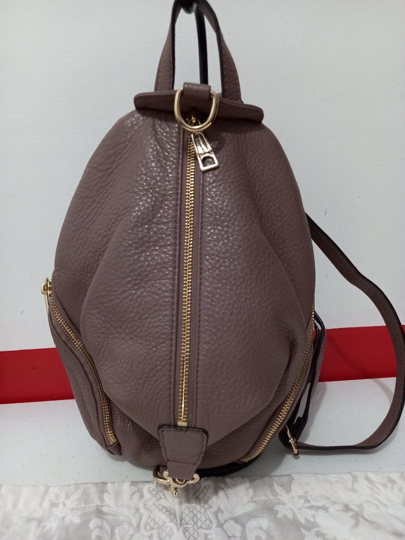 Rebecca Minkoff Backpack (Category: Backpacks) located in Manila. Submitted by zenphoenix-7ad615 (Listing ID 1412633005, Image 1). Description: - Stylish design - Multiple zippered compartments - Adjustable straps - Top handle - Textured material - Gold-toned hardware - Brand label inside - Versatile for everyday use 9.5 by 12 inches.