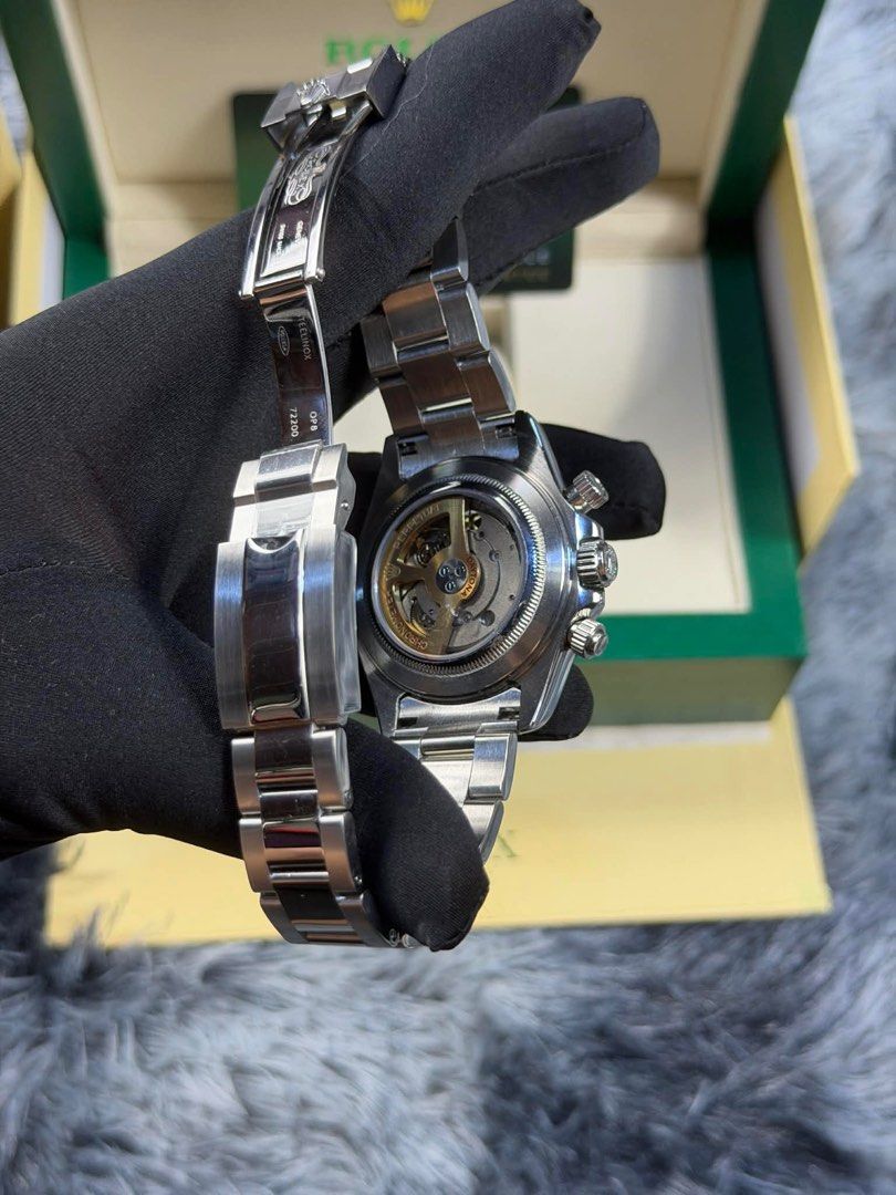 Rolex Daytona Stainless Steel Automatic Watch (Category: Luxury Watches) located in Manila. Submitted by mysticfalcon-6565 (Listing ID 1412662105, Image 2). Description: - Rolex Daytona stainless steel automatic watch - Features a white dial with chronograph sub-dials - Stainless steel bracelet with folding clasp - Includes original box and papers - Authentic Rolex.