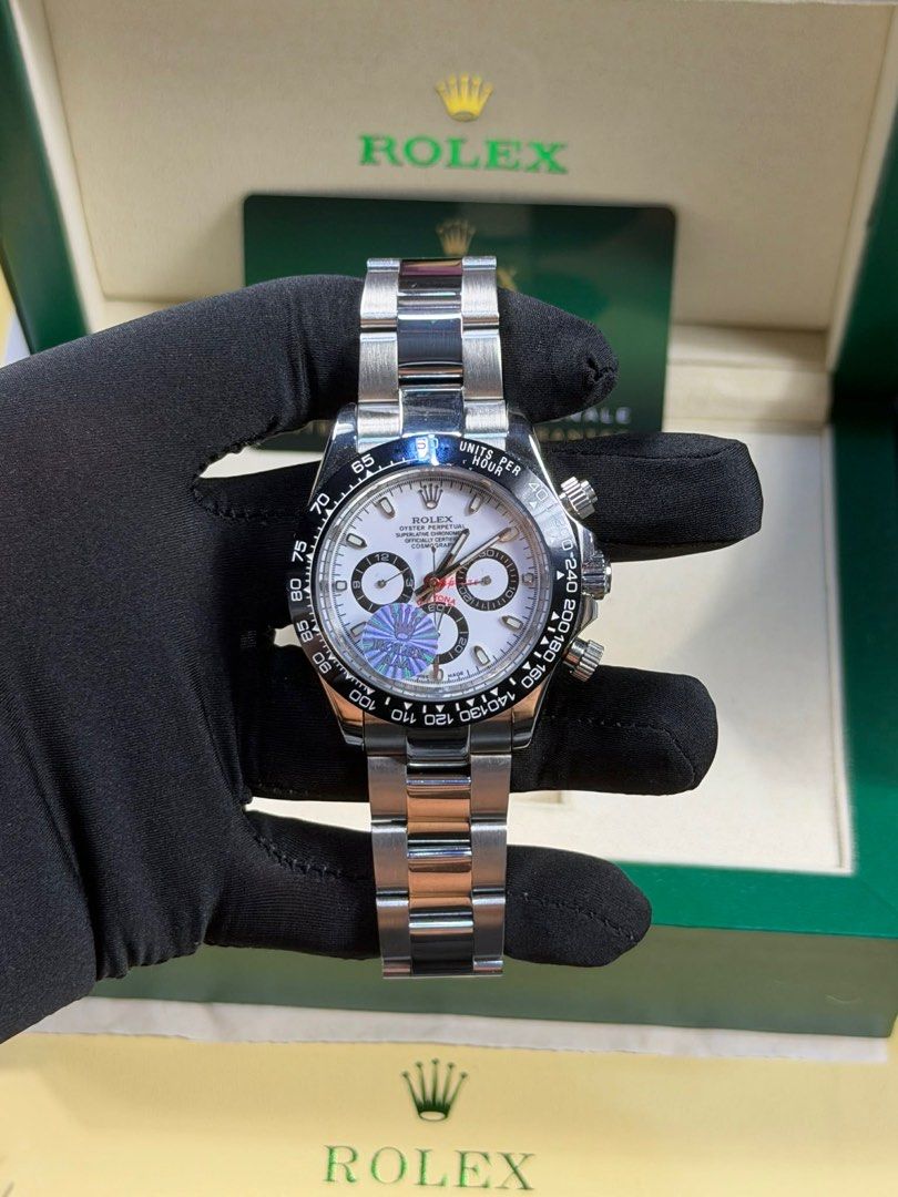 Rolex Daytona Stainless Steel Automatic Watch (Category: Luxury Watches) located in Manila. Submitted by mysticfalcon-6565 (Listing ID 1412662105, Image 1). Description: - Rolex Daytona stainless steel automatic watch - Features a white dial with chronograph sub-dials - Stainless steel bracelet with folding clasp - Includes original box and papers - Authentic Rolex.