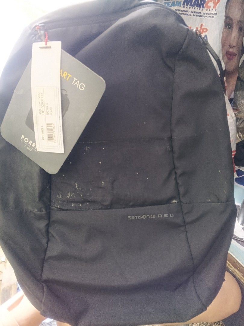 Samsonite RED Backpack (Category: Backpacks) located in Pasig City. Submitted by schizo225 (Listing ID 1412599199, Image 1). Description: Samsonite RED backpack is black and features multiple compartments. It has a smart tag and a 2-year global warranty. The interior includes pockets and the Samsonite RED logo. The backpack has padded shoulder straps and a mesh back panel for comfort. The model number is DF1*09001 cv..