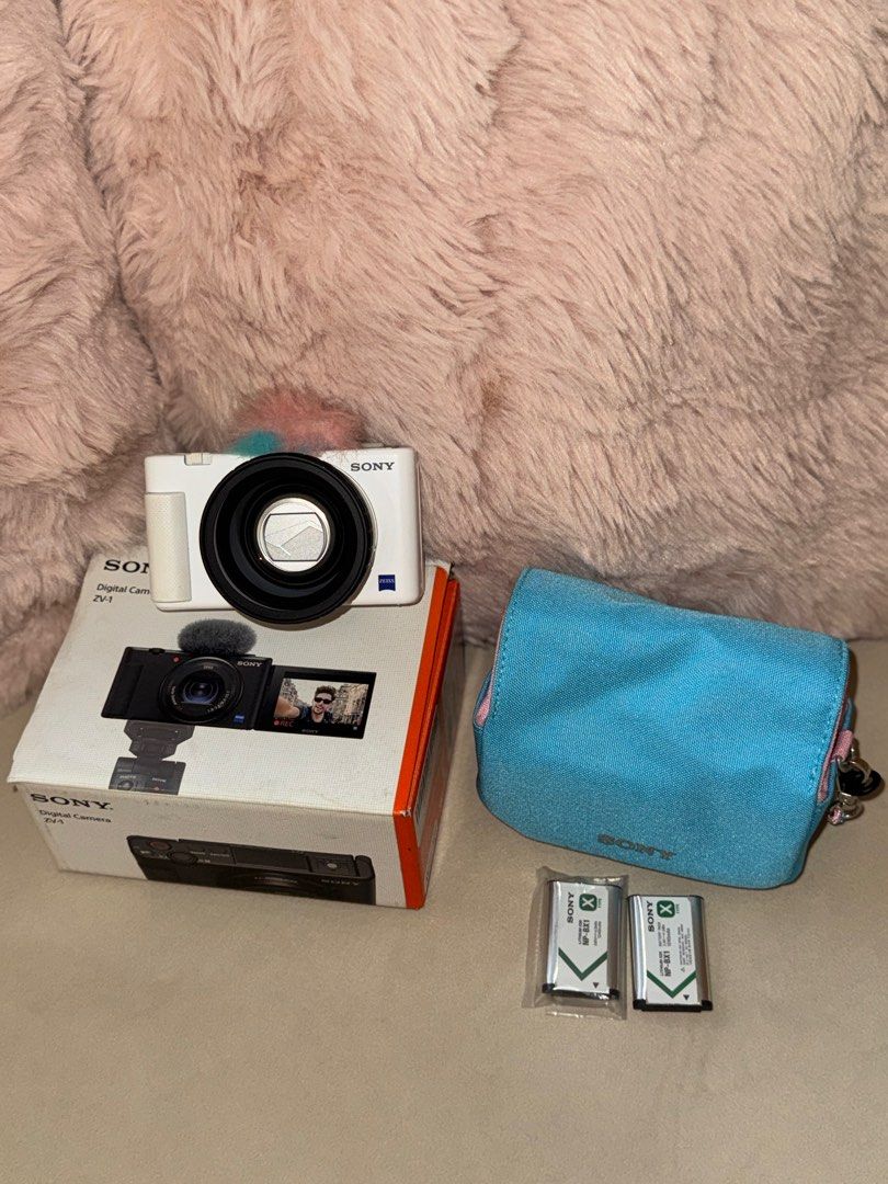 Sony ZV-1 Digital Camera with FREEBIES (Category: Cameras) located in Quezon City. Submitted by kct111 (Listing ID 1412662992, Image 2). Description: Price still negotiable, lightly used (lady-owned) - NO glass issues (clean & clear) - NO internal sensor issues Inclusions: - Built in Ulanzi WL-1 Wide Angle Lens - 2x Original Sony Batteries - 1x Official Sony ZV-1 Camera Pouch - Windscreen/fur foam cover for mic RFS: have multiple cameras/declutte