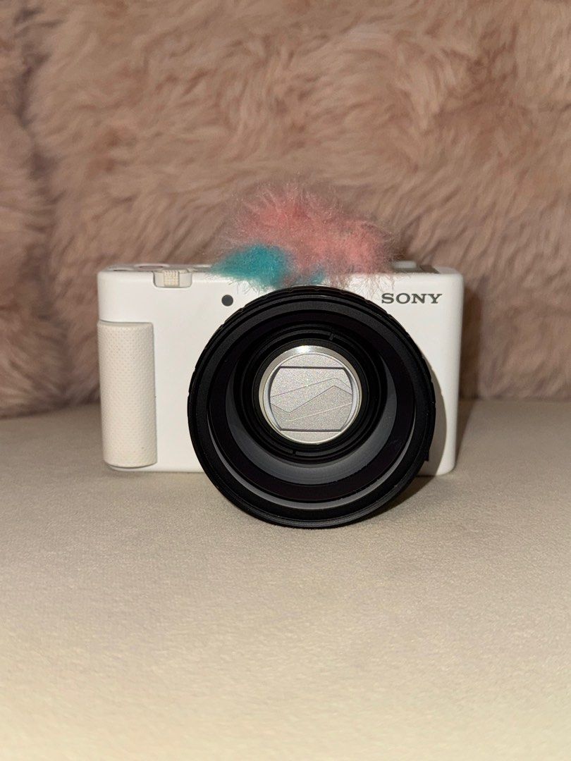 Sony ZV-1 Digital Camera with FREEBIES (Category: Cameras) located in Quezon City. Submitted by kct111 (Listing ID 1412662992, Image 3). Description: Price still negotiable, lightly used (lady-owned) - NO glass issues (clean & clear) - NO internal sensor issues Inclusions: - Built in Ulanzi WL-1 Wide Angle Lens - 2x Original Sony Batteries - 1x Official Sony ZV-1 Camera Pouch - Windscreen/fur foam cover for mic RFS: have multiple cameras/declutte