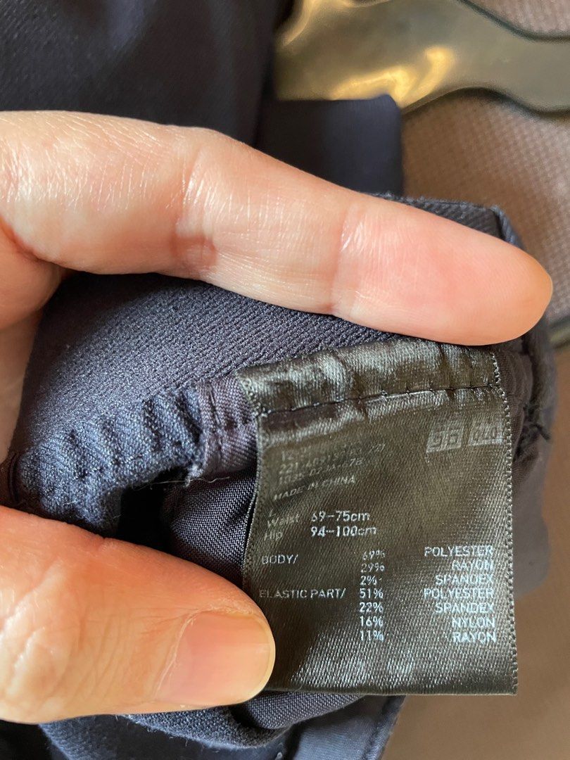 Uniqlo Navy Blue Trousers (Category: Other Bottoms) located in Quezon City. Submitted by anyapot (Listing ID 1412620583, Image 2). Description: - Color: Navy blue - Polyester, rayon, spandex and nylon fabric blend - Slimming on lower abdomen part.