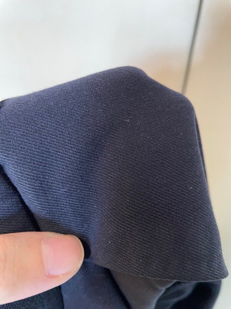 Uniqlo Navy Blue Trousers (Category: Other Bottoms) located in Quezon City. Submitted by anyapot (Listing ID 1412620583, Image 3). Description: - Color: Navy blue - Polyester, rayon, spandex and nylon fabric blend - Slimming on lower abdomen part.