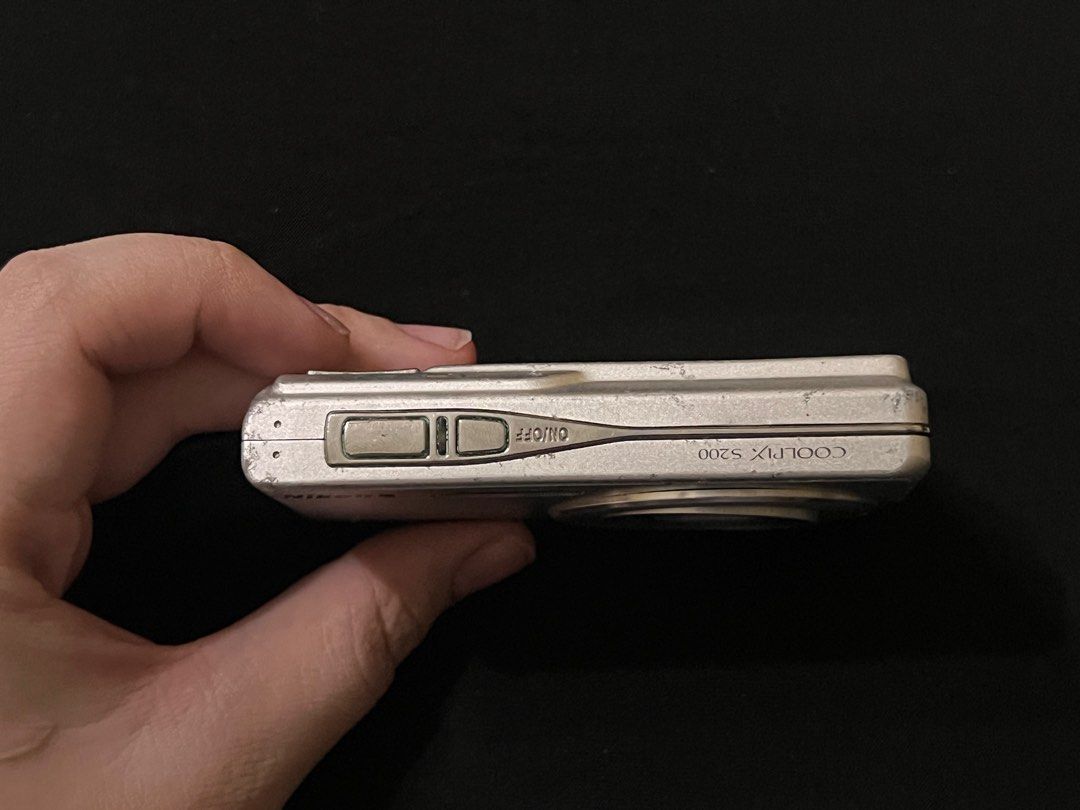 (UNTESTED) Nikon Coolpix S200 (Category: Cameras) located in Binangonan. Submitted by camco.7 (Listing ID 1412531990, Image 3). Description: Untested! Pls buy at your own risk. Selling as is. Unit lang po. Honest condition: It has a lot of marks and scratches. Lens part is also a bit tight to the feel. Most likely be for repair, but unfortunately there's not a lot of places for camera repair here in the province so I couldn't get it checked, nor 