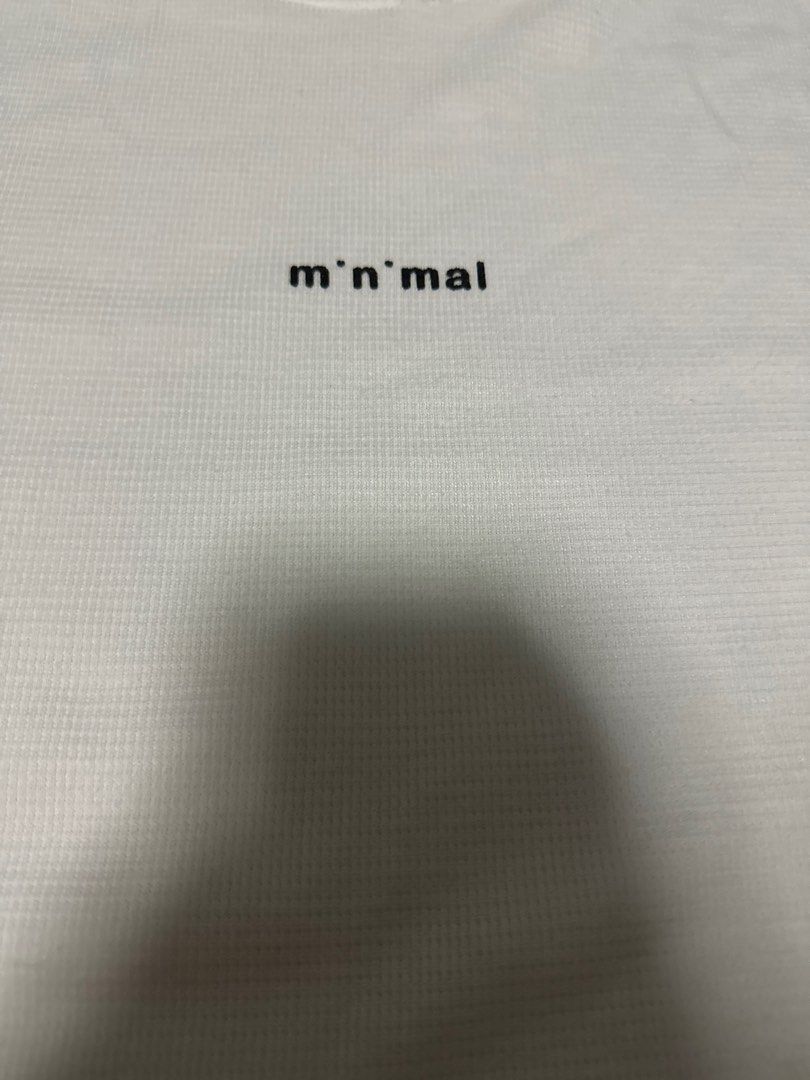 White basic Minimal tee (Category: Tshirts & Polo Shirts) located in Singapore. Submitted by alpha (Listing ID 1412659036, Image 2). Description: Preloved, seldom used. Asian fit, free size. Fits M size.