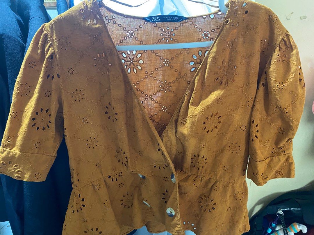 Zara Eyelet Top (Category: Blouses) located in Pasay City. Submitted by _jkching (Listing ID 1412563645, Image 2). Description: - Zara eyelet top - Mustard color - Size: S - V-neckline - Short puff sleeves - Peplum hem - Button-down closure - Made in India.