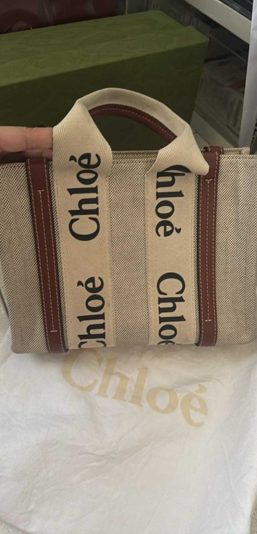Chloe Woody Tote Bag (Category: Luxury Bags & Wallets) located in Lingayen. Submitted by markjoceltagulinao (Listing ID 1412741083, Image 1). Description: - Authentic Chloe Woody tote bag - Features Chloe logo on handles - Beige canvas body - Brown leather accents - Includes dust bag - Stylish and practical everyday bag.