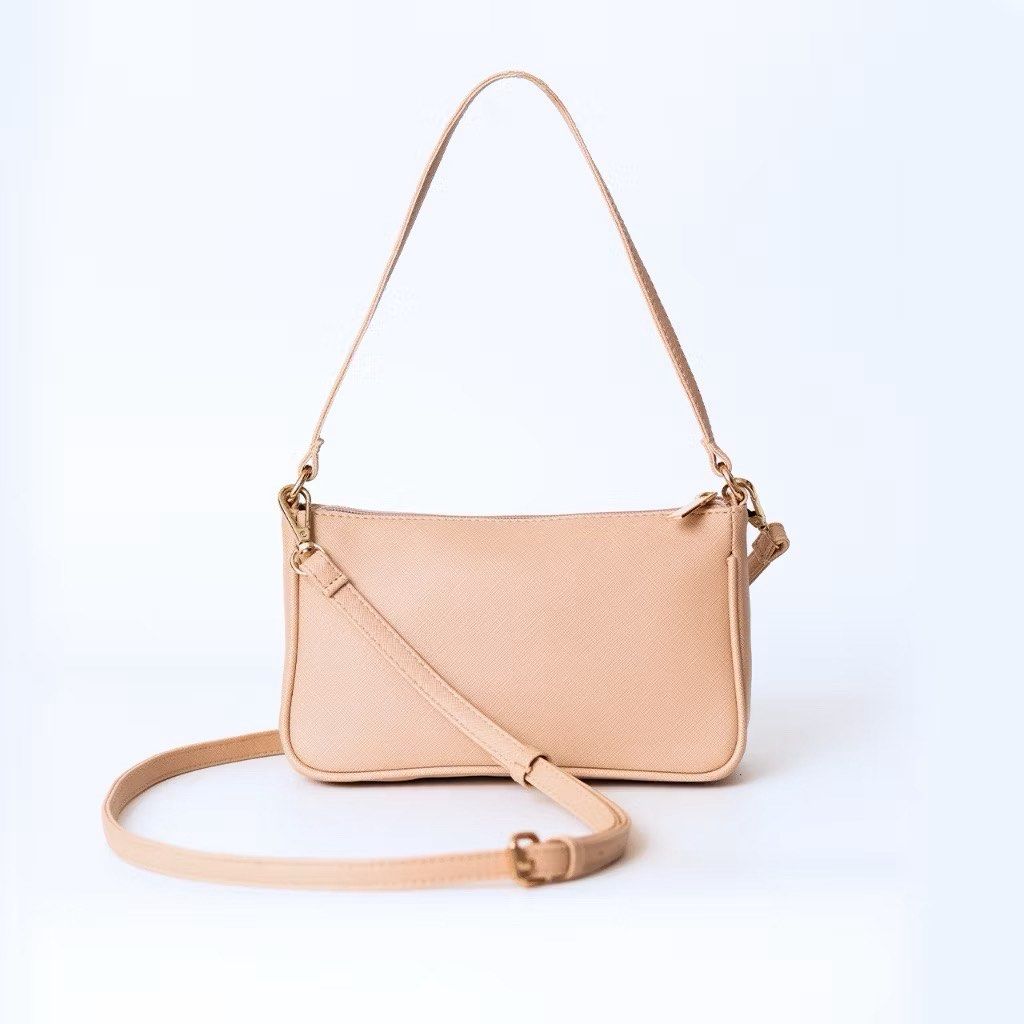 Daily Carry Sofia Baguette and Sling Bag (Category: Shoulder Bags) located in Quezon City. Submitted by koosgold (Listing ID 1412804235, Image 1). Description: dm me for more pics!! rfs: decluttering as i have too many bags - Beige shoulder bag - Rectangular shape - Adjustable long strap - Zipper closure - Gold-colored hardware.
