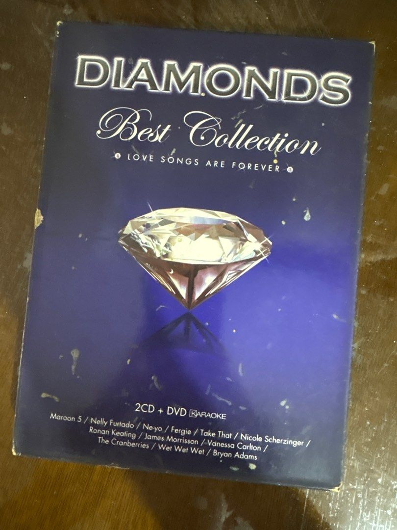 Diamonds Best Collection 2CD + DVD Karaoke (Category: CDs & DVDs) located in Pasig City. Submitted by knix01 (Listing ID 1412730960, Image 1). Description: Diamonds Best Collection featuring love songs. It includes 2 CDs and a DVD with karaoke versions. The artists featured include Maroon 5, Nelly Furtado, Take That, Nicole Scherzinger, Ronan Keating, James Morrison, The Cranberries, and Bryan Adams. It has a DVD karaoke.
