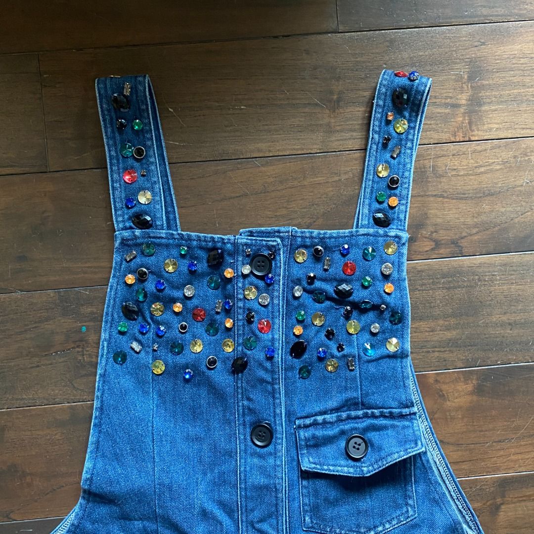 Dolce & Gabbana Beaded Denim Overalls Romper (Category: Rompers) located in Makati City. Submitted by valensweeno (Listing ID 1412738646, Image 3). Description: Dolce & Gabbana Beaded Denim Overalls Rare embellished denim piece from Dolce & Gabbana. Structured, with full button front and statement beading. In excellent condition, worn once. Hard to find and highly collectible, ideal for vintage lovers or designer denim fans..