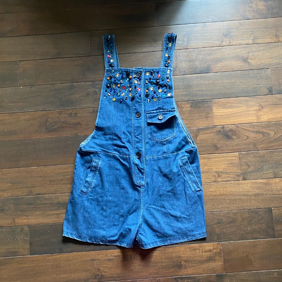 Dolce & Gabbana Beaded Denim Overalls Romper (Category: Rompers) located in Makati City. Submitted by valensweeno (Listing ID 1412738646, Image 2). Description: Dolce & Gabbana Beaded Denim Overalls Rare embellished denim piece from Dolce & Gabbana. Structured, with full button front and statement beading. In excellent condition, worn once. Hard to find and highly collectible, ideal for vintage lovers or designer denim fans..