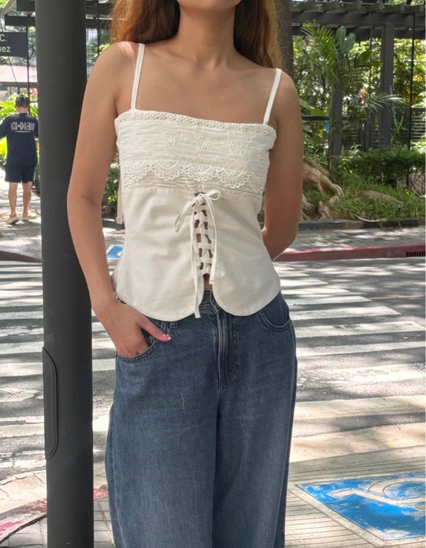 HEURE141 Portia Lace-up top (Category: Sleeveless) located in Quezon City. Submitted by bynini_archive (Listing ID 1412841439, Image 1). Description: - rfs: doesn’t fit me anymore - true to its size (based on the description) - retails for ₱1,580 loc: qc mop: gcash only mod: sdd or gogo express (no meetups) dm for more inquiries .