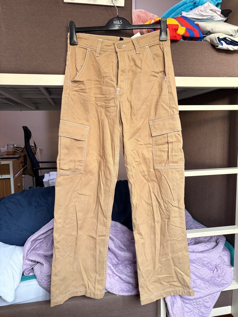 H&M Divided Cargo Brown Khaki Pants (Category: Jeans) located in Quezon City. Submitted by sofierz (Listing ID 1412764369, Image 1). Description: - H&M Divided tan cargo pants - Waist: ~30in - Features white stitching - Two front and two side pockets - Button and zipper closure - Size: EUR 34, UK 6, US 2, CN 155/64A - Neutral color.
