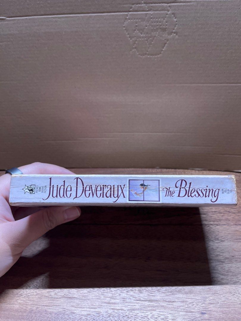 Jude Deveraux The Blessing Paperback (Category: Storybooks) located in Pasig City. Submitted by shadow53529 (Listing ID 1412729651, Image 2). Description: The Blessing by Jude Deveraux. - Paperback, mmpb - Condition: shows spine creasing, pages intact with obvious signs of browning and stain *️⃣ Payment first, no COD MOP: GCash, Maya, BPI, BDO Shipping: J&T.