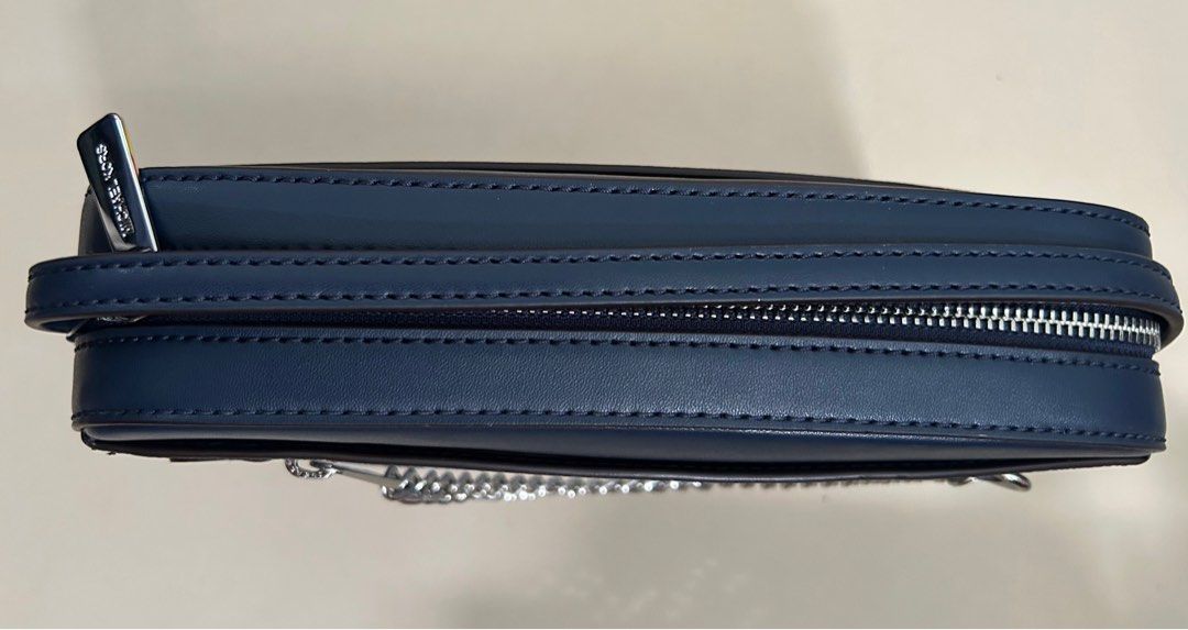 Michael Kors Jet Set Crossbody Bag (Category: Cross-body Bags) located in Pasig City. Submitted by jrrhs (Listing ID 1412777590, Image 2). Description: - Michael Kors Jet Set Item crossbody bag - Navy color - Silver chain strap - Zipper closure - MK logo pattern - MSRP: $258.00.