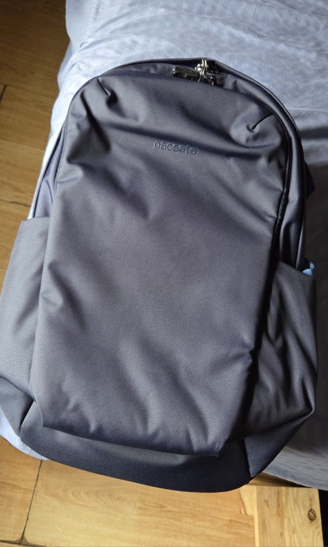 Pacsafe V 24L Active Anti-theft Backpack (Category: Backpacks) located in Quezon City. Submitted by charlieviii (Listing ID 1412727965, Image 2). Description: This spacious and sleek anti-theft backpack combines security and functionality. It features two roomy lockable compartments that can accommodate your travel essentials, along with a dedicated laptop sleeve designed to fit a 13-inch MacBook. For added comfort during your travels, the backpa