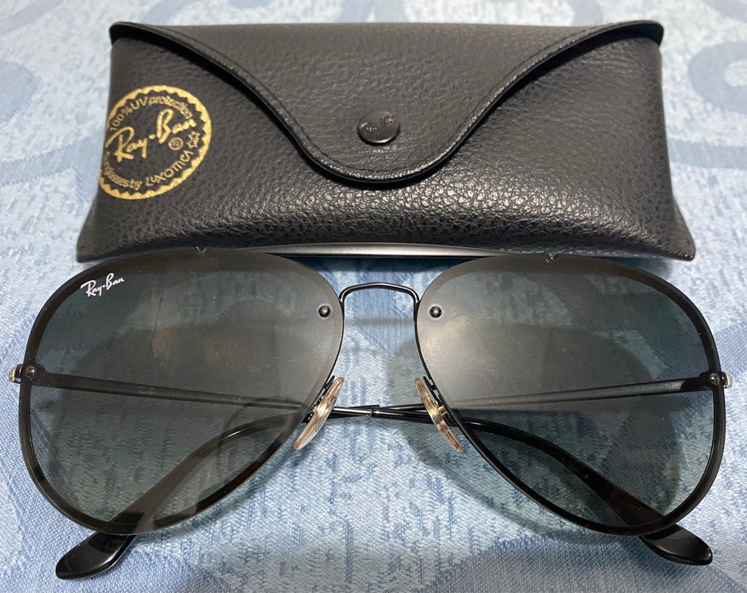 Ray-Ban Aviator Sunglasses (Category: Sunglasses & Eyewear) located in Cagayan de Oro. Submitted by cu_2022 (Listing ID 1412856020, Image 1). Description: Classic Ray-Ban Aviator sunglasses. Features a black frame and dark lenses. Includes the original case. The Ray-Ban logo is visible on the lens and the case. A timeless design suitable for various occasions..
