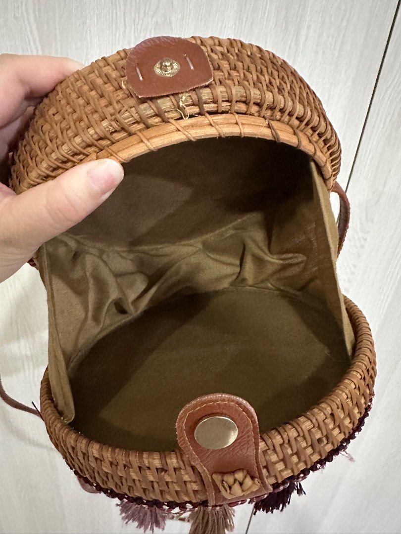 Round Woven Handbag with Tassels (Category: Tote Bags) located in Paranaque City. Submitted by elenyuloque (Listing ID 1412823509, Image 2). Description: - Woven round handbag - Brown strap - Decorative colorful tassels - Fabric lining - Snap closure - Good size for essentials.
