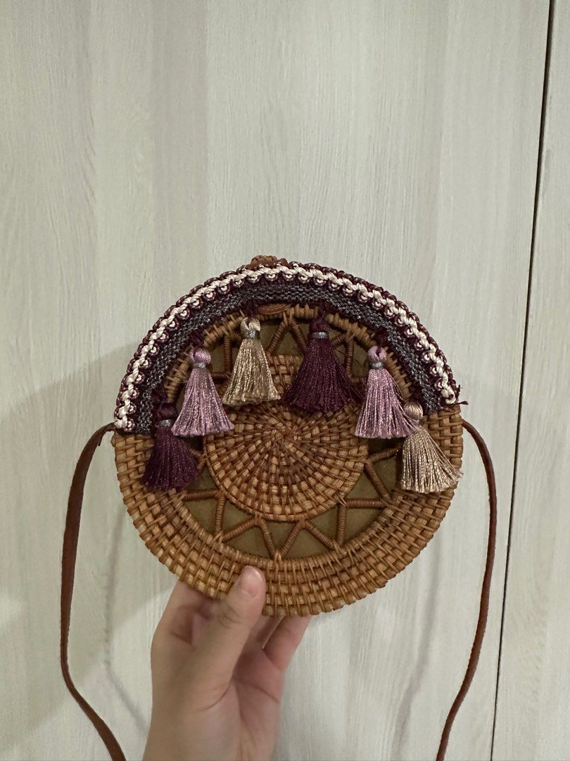 Round Woven Handbag with Tassels (Category: Tote Bags) located in Paranaque City. Submitted by elenyuloque (Listing ID 1412823509, Image 1). Description: - Woven round handbag - Brown strap - Decorative colorful tassels - Fabric lining - Snap closure - Good size for essentials.
