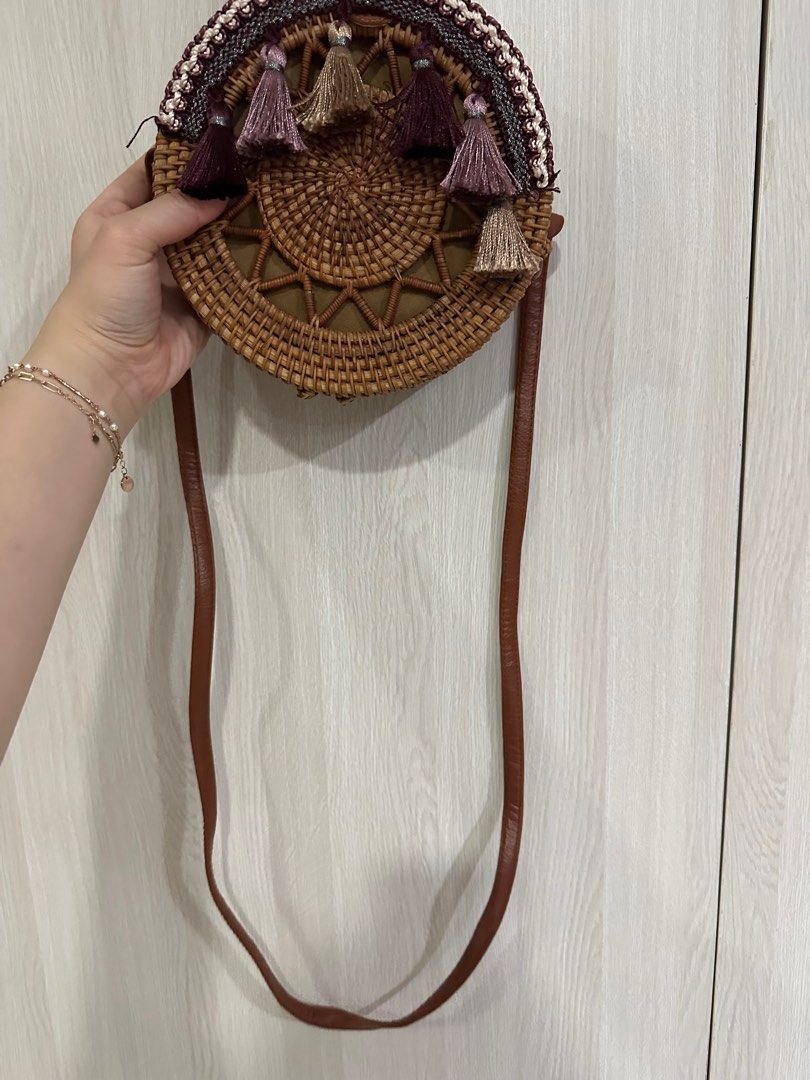 Round Woven Handbag with Tassels (Category: Tote Bags) located in Paranaque City. Submitted by elenyuloque (Listing ID 1412823509, Image 3). Description: - Woven round handbag - Brown strap - Decorative colorful tassels - Fabric lining - Snap closure - Good size for essentials.