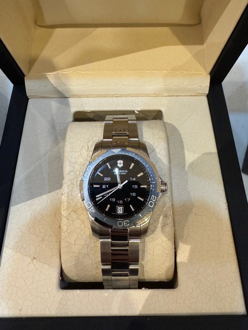 Victorinox Swiss Watch (Category: Women's Watches) located in Quezon City. Submitted by digitalthrifting (Listing ID 1412840315, Image 1). Description: - Victorinox Swiss Army watch - Black dial - Stainless steel bracelet - Includes original box and instruction manual - Extra link included - Date display - Rotating bezel.