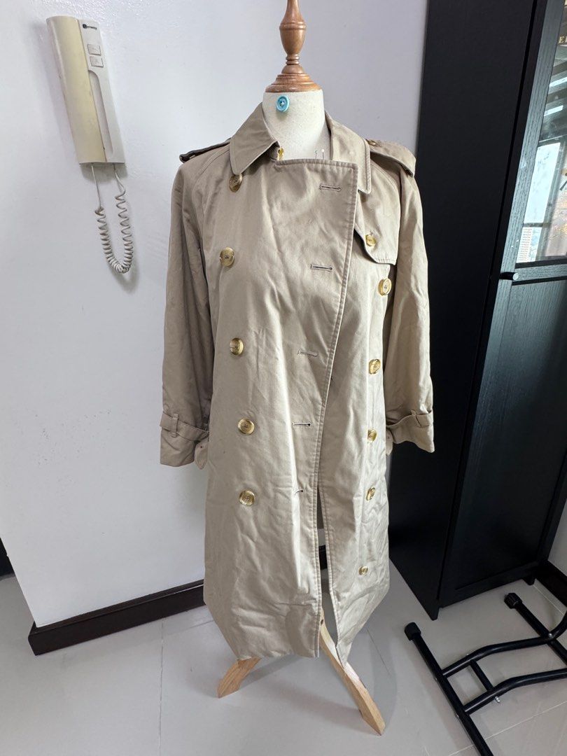 Vintage BurberryTrench Coat (Category: Coats, Jackets and Outerwear) located in Quezon City. Submitted by vaninni (Listing ID 1412724080, Image 1). Description: - Authentic Burberrys trench coat - Double-breasted design - Includes button closures and matching belt - Features iconic Burberry check lining - Made in England - Timeless design.
