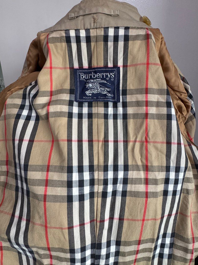 Vintage BurberryTrench Coat (Category: Coats, Jackets and Outerwear) located in Quezon City. Submitted by vaninni (Listing ID 1412724080, Image 3). Description: - Authentic Burberrys trench coat - Double-breasted design - Includes button closures and matching belt - Features iconic Burberry check lining - Made in England - Timeless design.