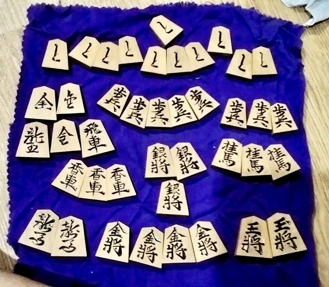 Vintage Shogi Chess Pieces only (as - is) (Category: Board Games & Puzzles) located in Santa Rosa. Submitted by animemerchcollection (Listing ID 1412812122, Image 1). Description: - Complete Shogi chess piece set - Made of wood - Features black ink characters - Includes all standard pieces - Ideal for collectors and Shogi learners -as is 41 pcs.