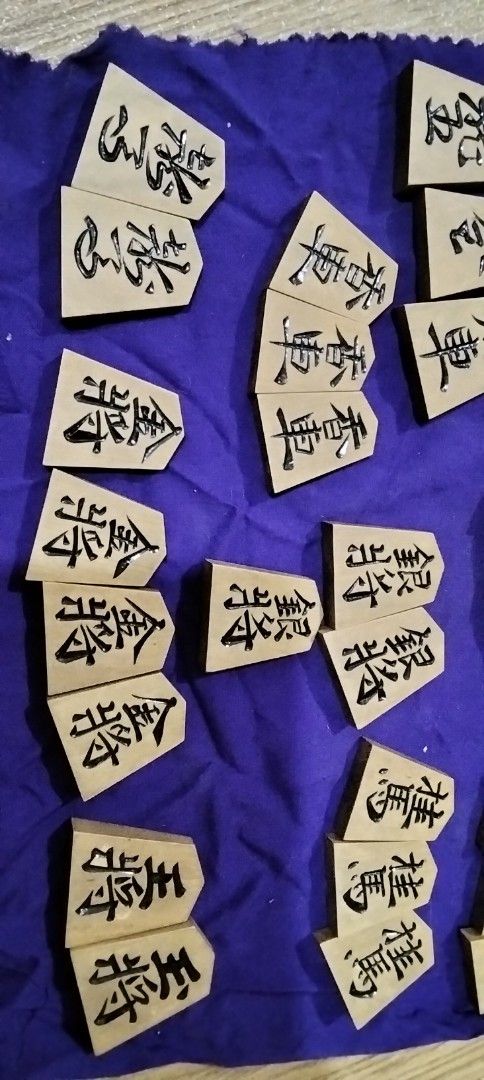 Vintage Shogi Chess Pieces only (as - is) (Category: Board Games & Puzzles) located in Santa Rosa. Submitted by animemerchcollection (Listing ID 1412812122, Image 2). Description: - Complete Shogi chess piece set - Made of wood - Features black ink characters - Includes all standard pieces - Ideal for collectors and Shogi learners -as is 41 pcs.