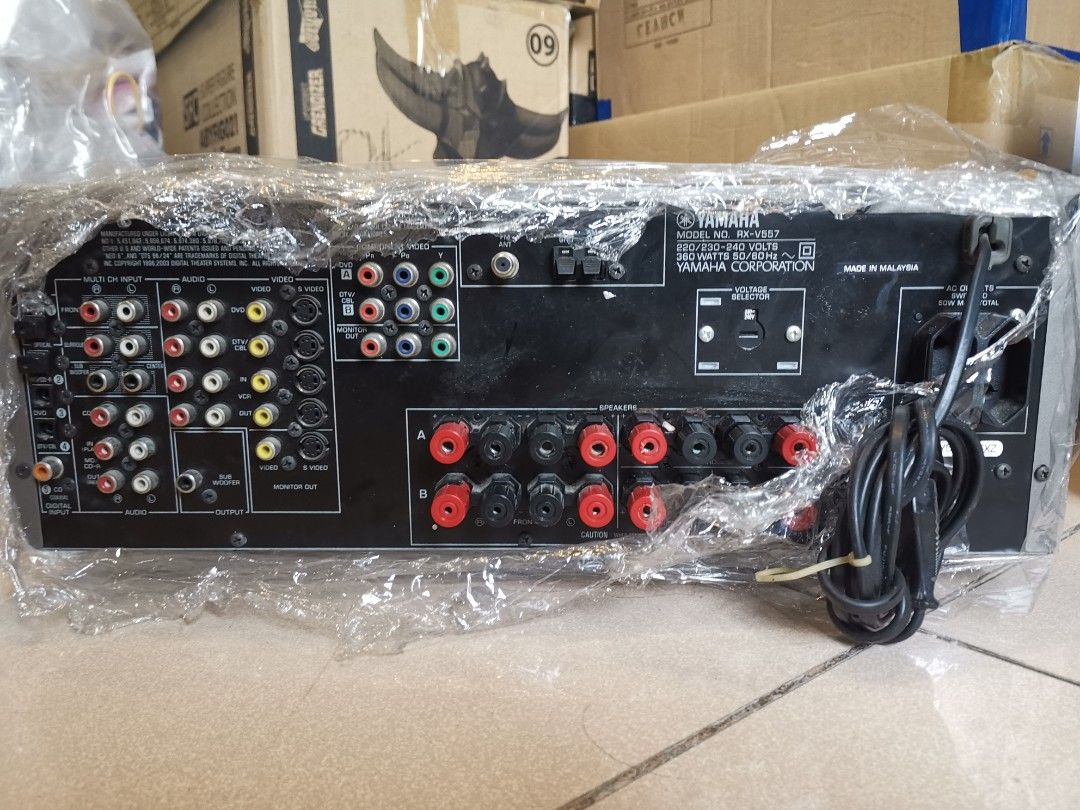 Yamaha RX-V557 AV Receiver (Category: Soundbars, Speakers & Amplifiers) located in Manila. Submitted by genesis11_21 (Listing ID 1412772911, Image 2). Description: WORKING GOOD CONDITION Yamaha RX-V557 AV receiver. Features multiple input and output ports for various audio and video devices. It has a power rating of 360 watts and operates on 220/230-240 volts. Made in Malaysia. Includes a voltage selector for 230-240V. The front panel has various