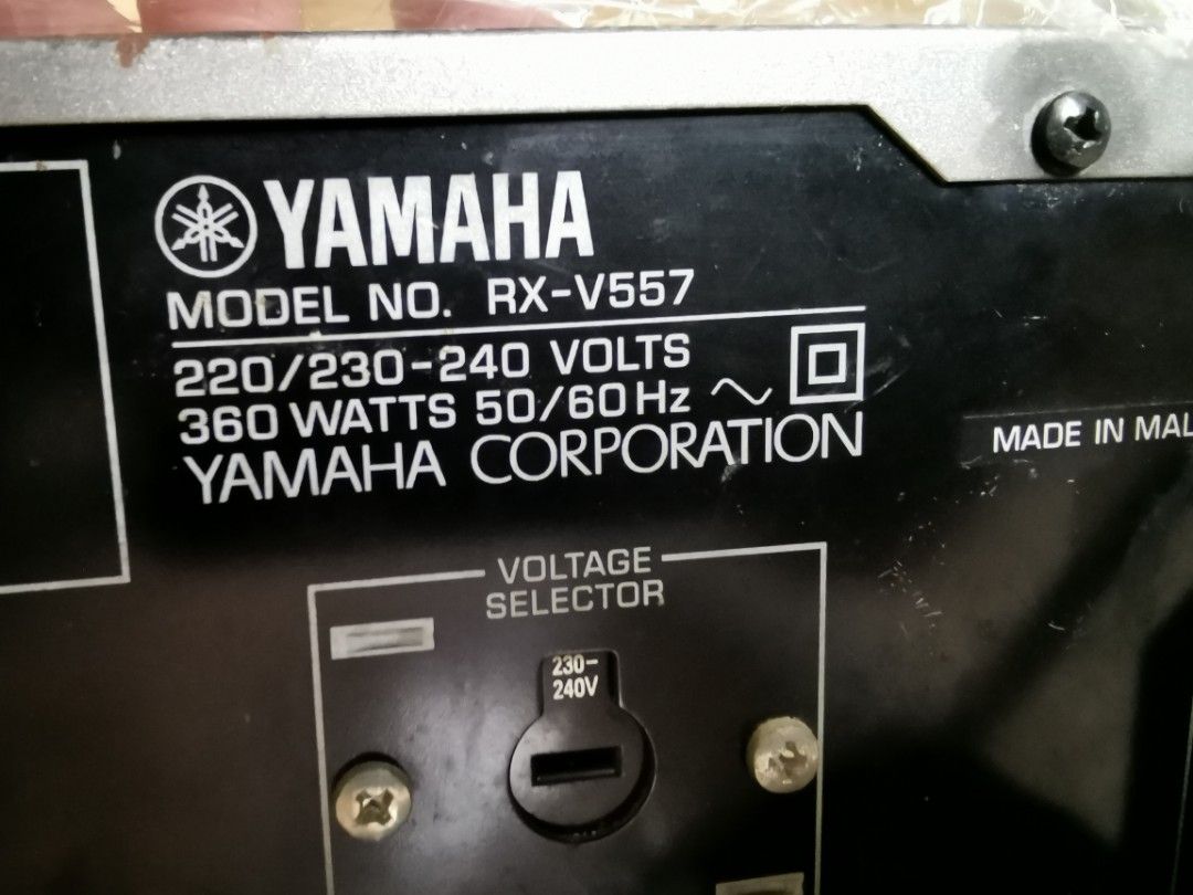 Yamaha RX-V557 AV Receiver (Category: Soundbars, Speakers & Amplifiers) located in Manila. Submitted by genesis11_21 (Listing ID 1412772911, Image 3). Description: WORKING GOOD CONDITION Yamaha RX-V557 AV receiver. Features multiple input and output ports for various audio and video devices. It has a power rating of 360 watts and operates on 220/230-240 volts. Made in Malaysia. Includes a voltage selector for 230-240V. The front panel has various