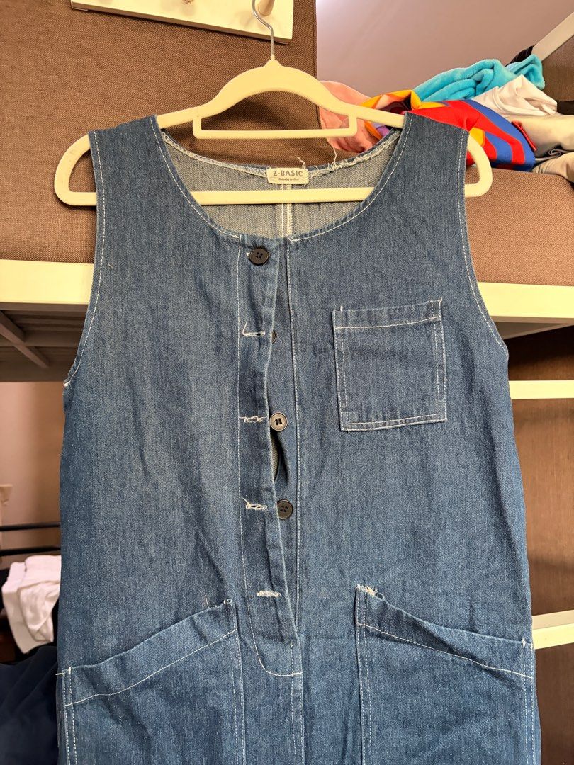 Z-Basic Denim Jumpsuit Romper Button Up (Category: Jumpsuits) located in Quezon City. Submitted by sofierz (Listing ID 1412764372, Image 2). Description: - Z-Basic Denim Jumpsuit - Fits small to semi-medium - Sleeveless design - Button-down front - Features two front pockets and two chest pockets - Relaxed fit - Straight leg - Medium-wash denim.