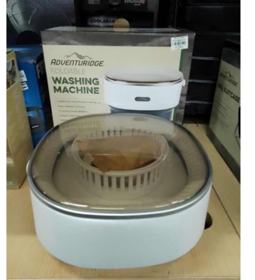 Adventuridge Foldable Washing Machine (Category: Washing Machines and Dryers) located in Angono. Submitted by mrallstuff (Listing ID 1407771172, Image 2). Description: Brand: Adventuridge Model Number: WUN-PWM-X201 Capacity: 8.5 Liters (8.5L) Type: Portable, Mini Washing Machine Design: Foldable/Collapsible for compact storage Color: White and Grey Controls: Touch panel with power button and multiple wash modes/timers (icons visible, indicating w