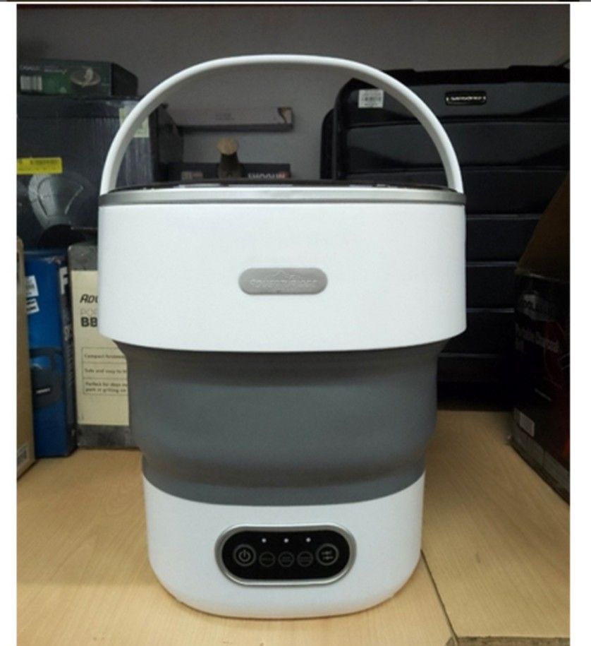 Adventuridge Foldable Washing Machine (Category: Washing Machines and Dryers) located in Angono. Submitted by mrallstuff (Listing ID 1407771172, Image 1). Description: Brand: Adventuridge Model Number: WUN-PWM-X201 Capacity: 8.5 Liters (8.5L) Type: Portable, Mini Washing Machine Design: Foldable/Collapsible for compact storage Color: White and Grey Controls: Touch panel with power button and multiple wash modes/timers (icons visible, indicating w