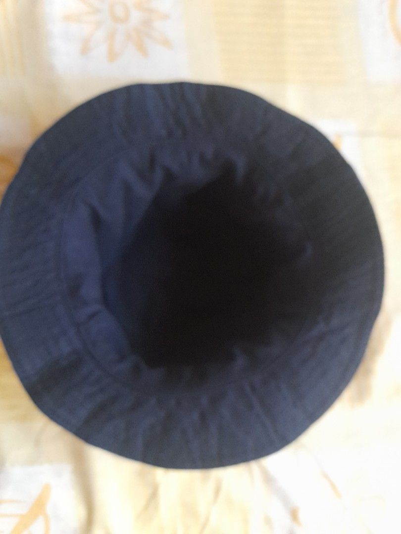 Bucket Hat (Category: Looking For) located in San Pedro. Submitted by JohnsonKeeps (Listing ID 1407830498, Image 2). Description: - Unique navy blue and white printed design - Wide brim for sun protection - Comfortable fit - Navy blue interior - Adds flair to any outfit.