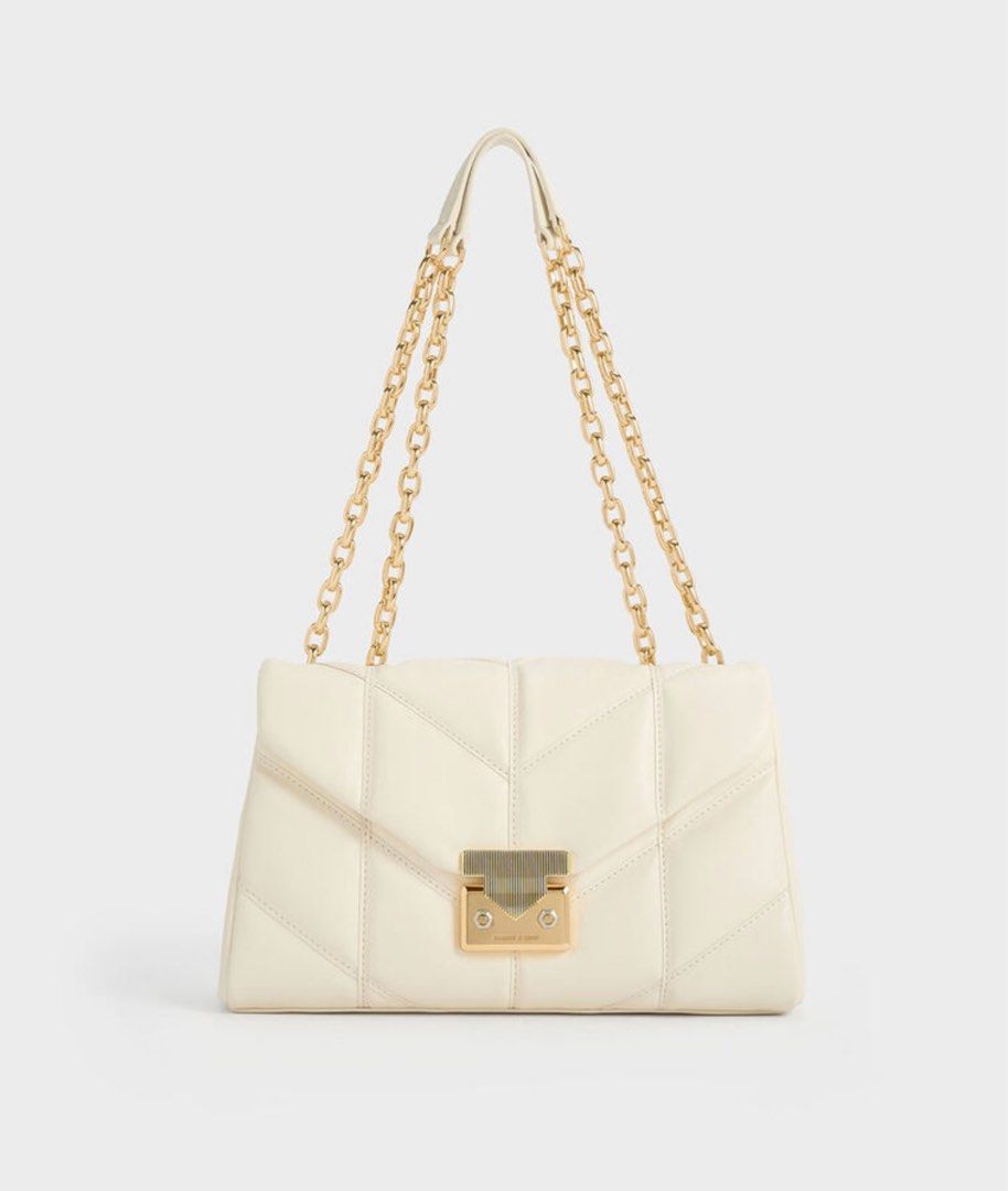 Charles and Keith Eudora Chevron Trapeze bag (Category: Shoulder Bags) located in Malabon City. Submitted by decluttergyal (Listing ID 1407774891, Image 1). Description: Last price posted. Used once, bought from Singapore. I have the dust bag with me. Very spacious inside, can be used as a shoulder bag or a crossbody. Tags: bags, purses, charles and keith, zara, mango, stradivarius, bershka.