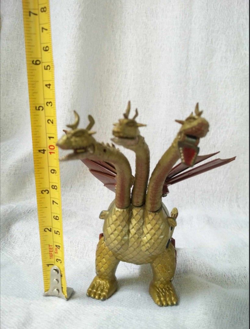 Die-cast Bullmark King Ghidorah (Category: Figurines & Statues) located in Caloocan City. Submitted by banshee8818 (Listing ID 1407884260, Image 2). Description: - Vintage Bullmark King Ghidorah toy figure - Includes original box and inserts - Features three heads, wings, and detailed body - Box features King Ghidorah illustration - Made in Japan - Approximately 6 inches tall.