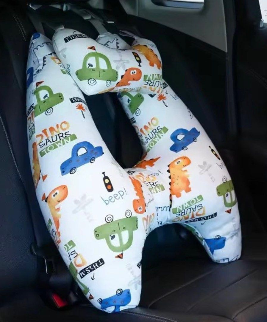 Dinosaur Print Pillow Car (Category: Car Seats) located in Pasay City. Submitted by szepter (Listing ID 1406321027, Image 3). Description: - Fun dinosaur and car print design - Curved design for comfortable breastfeeding support - Includes a smaller, detachable pillow for added support - Features straps for secure positioning - Soft fabric and colorful design.