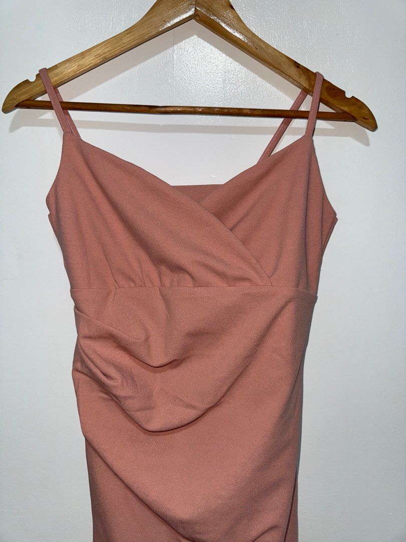 Dusty Rose Midi Dress (Category: Dresses) located in Manila. Submitted by angz12 (Listing ID 1407791562, Image 3). Description: - Dusty rose midi dress - Wrap-style bodice - Spaghetti straps - Fitted silhouette - Asymmetrical hemline - Perfect for special occasions - Subtle ruched side detail.