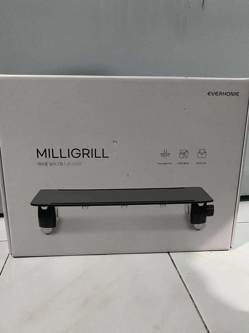 Everhome MilliGrill JF-G201 from Korea (Category: BBQ, Grills & Hotpots) located in Caloocan City. Submitted by dang_26 (Listing ID 1407758487, Image 1). Description: - Brand new Everhome MilliGrill JF-G201 - Still in original packaging - Stylish black design - Compact size, ideal for small spaces - Features 5mm thickness - Easy to clean.